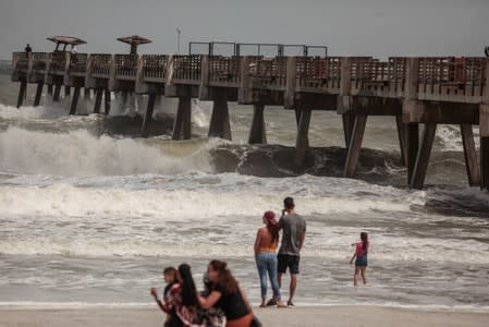 Beach waves reach to the top of Jacksonville Beach Pier before Hurricane Dorian in Jacksonville