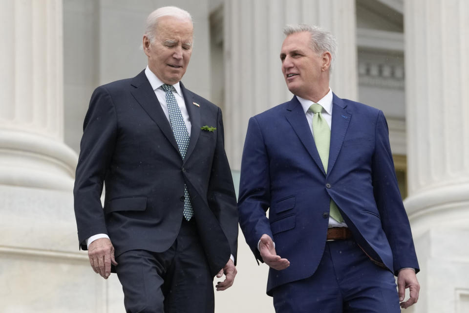 FILE - President Joe Biden talks with House Speaker Kevin McCarthy of Calif., as they walk down the House steps as they leave after attending an annual St. Patrick's Day luncheon gathering at the Capitol in Washington, March 17, 2023. The Tuesday, May 9, White House sitdown between the president and congressional leaders will be the first substantive talks between Biden and McCarthy in months, and comes weeks after House Republicans voted on a bill that would raise the debt limit but impose significant federal spending cuts. (AP Photo/Alex Brandon, File)
