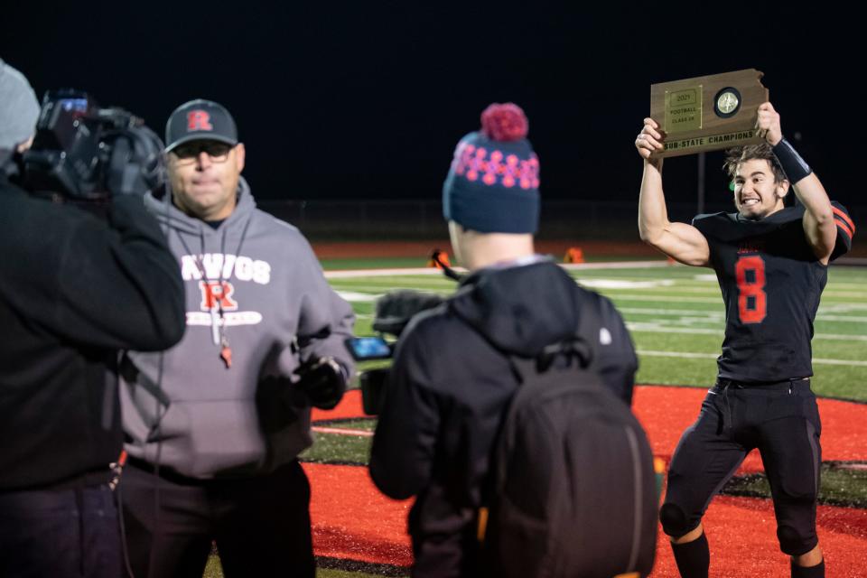 Rossville's Raphael Cooney (8) photobombs head coach Derick Hammes on Nov. 19 at Rossville High School.