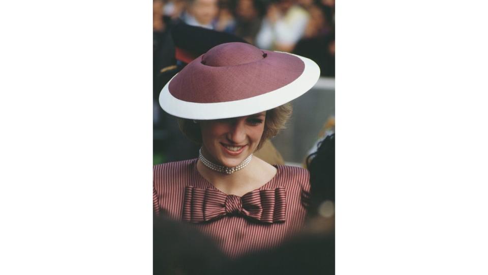 Diana smiling in bow adorned dress