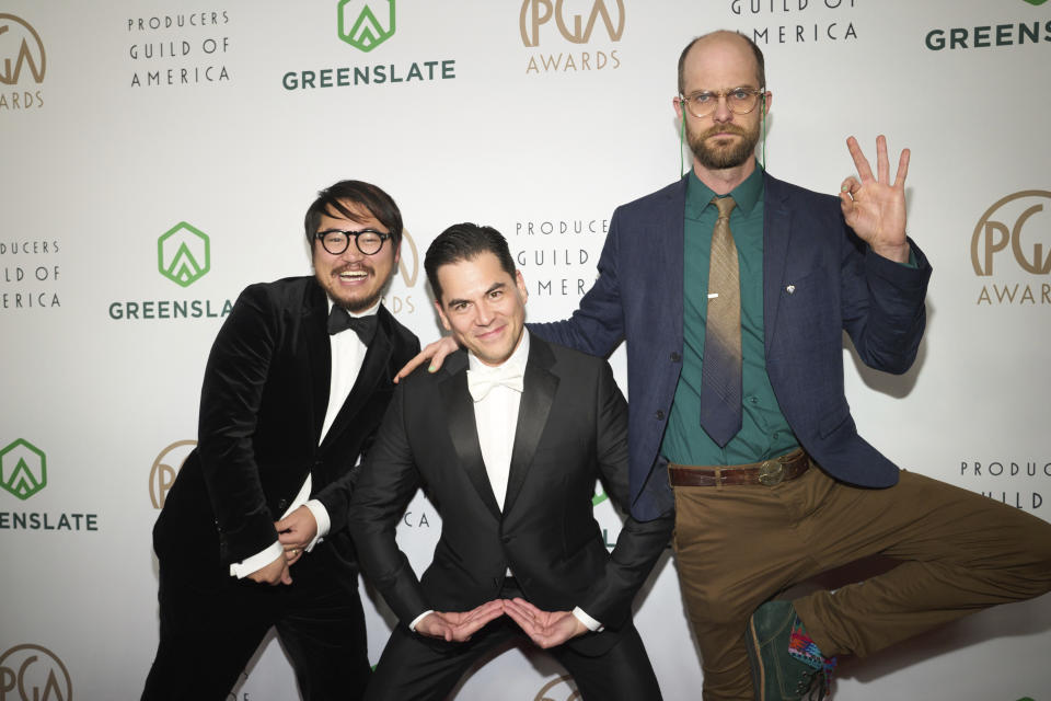 Daniel Kwan, from left, Jonathan Wang, and Daniel Scheinert arrive at the 34th annual Producers Guild Awards on Saturday, Feb. 25, 2023, at the Beverly Hilton Hotel in Beverly Hills, Calif. (Photo by Allison Dinner/Invision/AP)