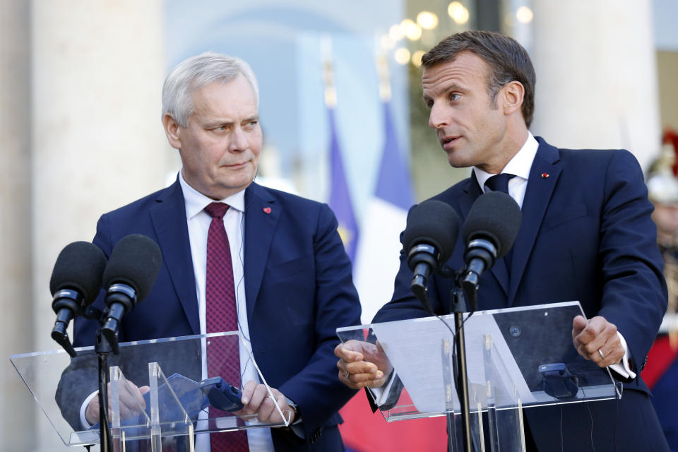 France's President Emmanuel Macron, right, and Prime Minister of Finland Antti Rinne, give a speech prior to a meeting, at the Elysee Palace, in Paris, Wednesday, Sept. 18, 2019. (AP Photo/Thibault Camus)