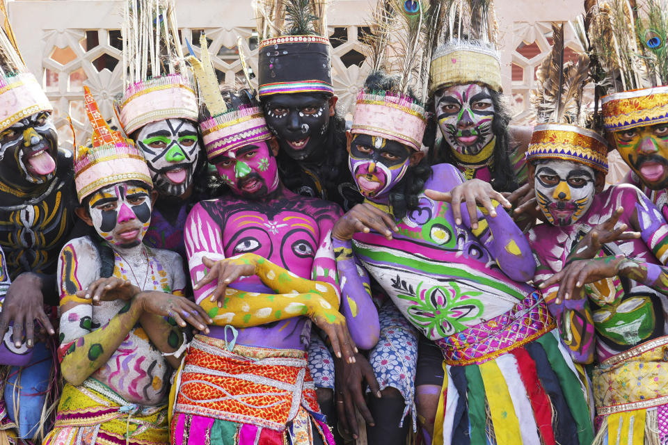 Folk dancers from Sahariya tribe pose for a photograph before a road show by French President Emmanuel Macron and Indian Prime Minister Narendra Modi began in Jaipur, Rajasthan, India, Thursday, Jan. 25, 2024. Macron will be the chief guest at India's annual republic day parade in New Delhi on Friday. (AP Photo/ Deepak Sharma)