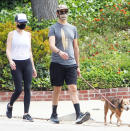 <p>Kristen Wiig and fiancé Avi Rothman take their dog for a walk on Monday in Los Angeles.</p>