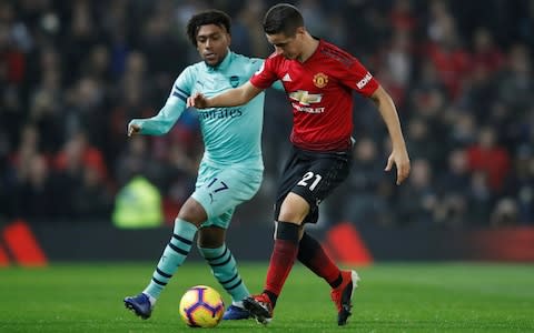 Manchester United's Ander Herrera in action with Arsenal's Alex Iwobi - Credit: Action Images via Reuters/Carl Recine