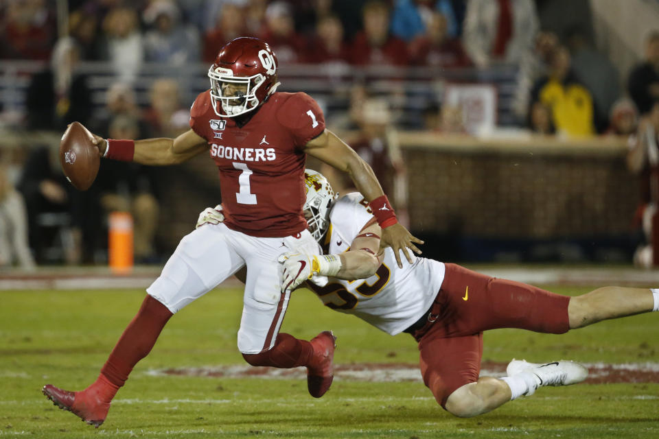 Oklahoma quarterback Jalen Hurts (1) during an NCAA college football game between Iowa State and Oklahoma in Norman, Okla., Saturday, Nov. 9, 2019. (AP Photo/Sue Ogrocki)