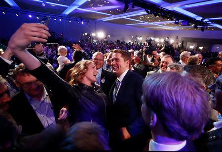 Andrew Scheer takes a selfie on stage after winning the leadership at the Conservative Party of Canada leadership convention in Toronto, Ontario, Canada, May 27, 2017. REUTERS/Mark Blinch