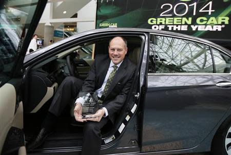 Mike Accavitti, senior vice president of automobile operations at American Honda, sits in the 2014 Honda Accord Hybrid which was named "Green Car of the Year", at the Los Angeles Auto Show in Los Angeles, California, November 21, 2013. REUTERS/Lucy Nicholson