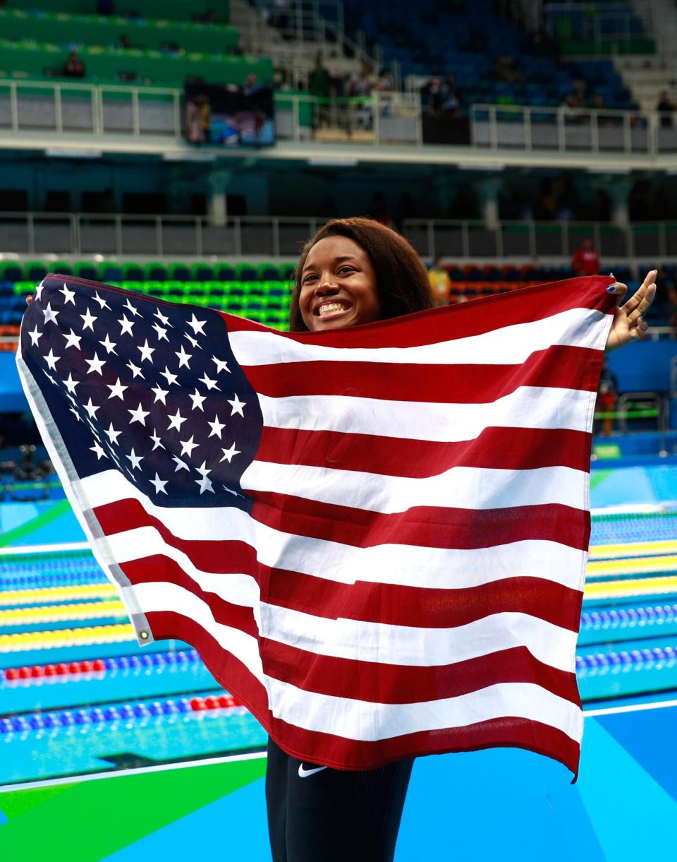 <p>She set a new American record becoming the first African-American woman to win a gold medal in an individual swimming event. (Getty) </p>