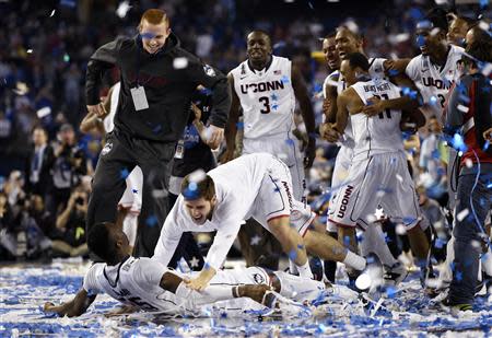 Apr 7, 2014; Arlington, TX, USA; Connecticut Huskies center Amida Brimah (35) celebrates with teammates after defeating the Kentucky Wildcats in the championship game of the Final Four in the 2014 NCAA Mens Division I Championship tournament at AT&T Stadium. Robert Deutsch-USA TODAY Sports