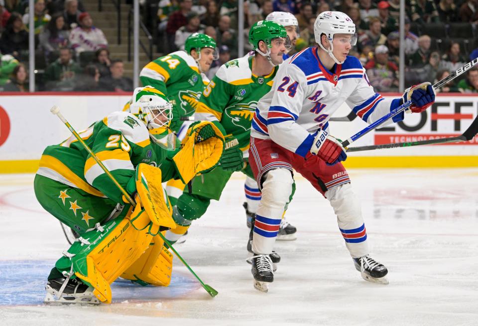 Nov 4, 2023; Saint Paul, Minnesota, USA; Minnesota Wild goalie Marc-Andre Fleury (29) and New York Rangers forward Kaapo Kakko (24) track the puck during the third period at Xcel Energy Center.