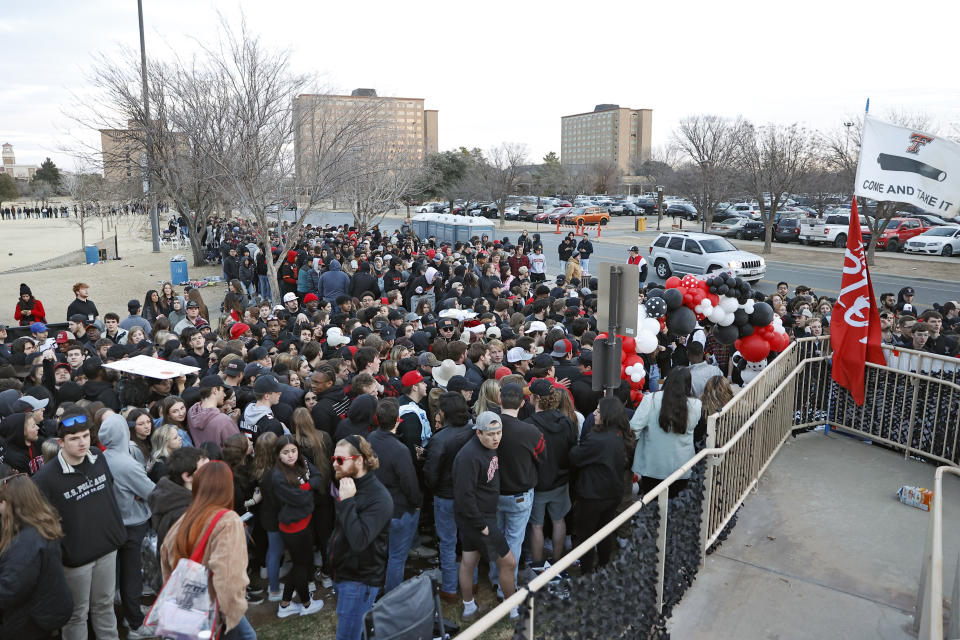 Texas Tech students line up to enter the arena before an NCAA college basketball game against Texas, Tuesday, Feb. 1, 2022, in Lubbock, Texas. (AP Photo/Brad Tollefson)