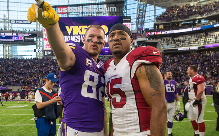 Nov 20, 2016; Minneapolis, MN, USA; Minnesota Vikings tight end Kyle Rudolph (82) and Arizona Cardinals wide receiver Michael Floyd (15) following the game at U.S. Bank Stadium. The Vikings defeated the Cardinals 30-24. Mandatory Credit: Brace Hemmelgarn-USA TODAY Sports