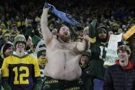 Green Bay Packers fans cheer during the second half of an NFL football game against the Los Angeles Rams Sunday, Nov. 28, 2021, in Green Bay, Wis. (AP Photo/Aaron Gash)