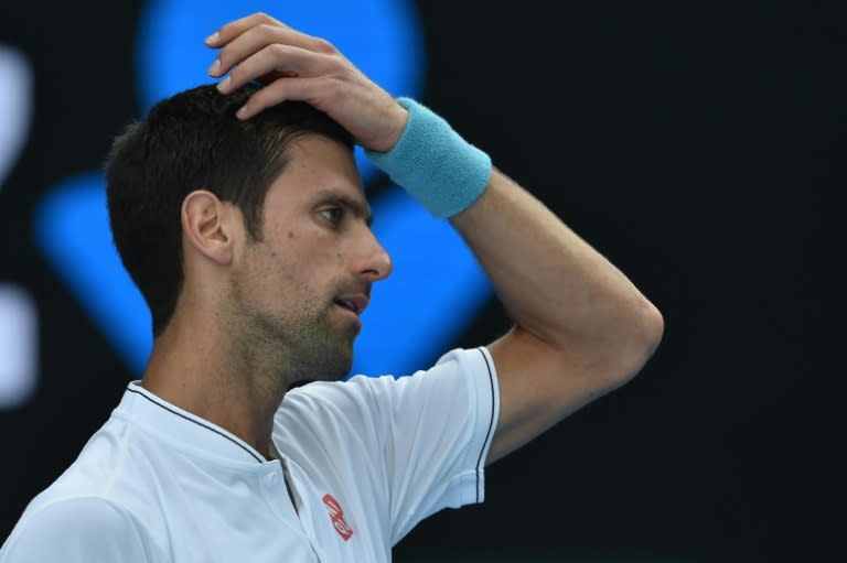 Novak Djokovic crashed out to unheralded Denis Istomin in five sets on Thursday in the world number two's earliest exit from a major since Wimbledon 2008