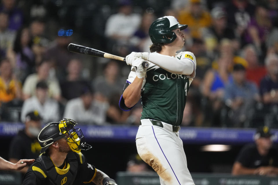 Colorado Rockies' Michael Toglia watches his three-run home run off Pittsburgh Pirates relief pitcher Dennis Santana during the eighth inning of a baseball game Saturday, June 15, 2024, in Denver. (AP Photo/David Zalubowski)