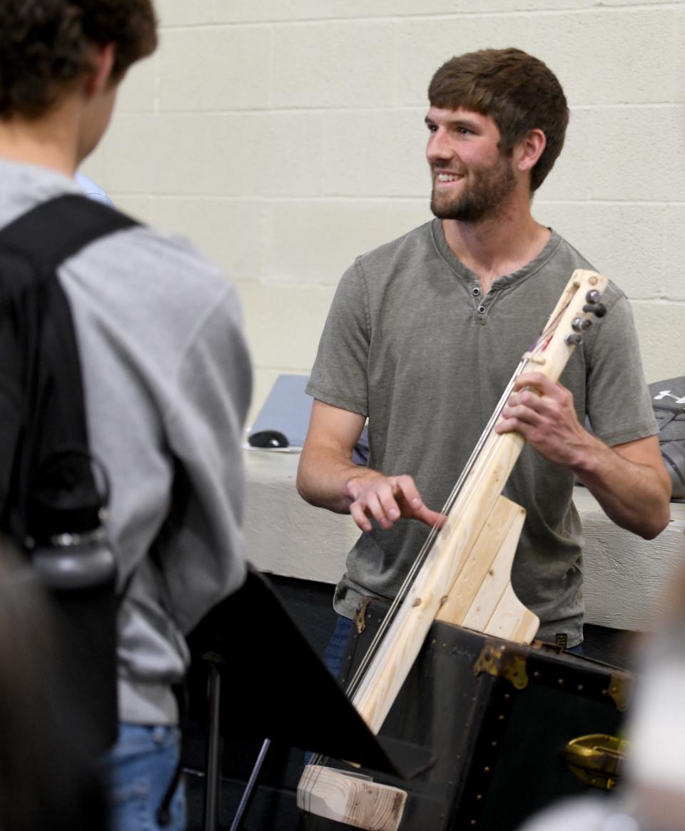 "Science, Sound and Music" students prepare for a recent performance at the University of Mount Union. Vincent Giumenti, a junior majoring in mechanical engineering, is among the students who constructed homemade instruments as part of physics professor Robert Ekey's class.