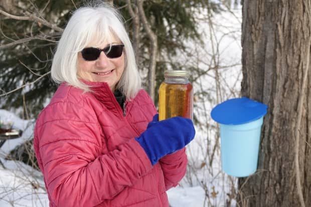 Janet Perry has been making maple syrup from trees in her own backyard for years.  (Giacomo Panico/CBC - image credit)