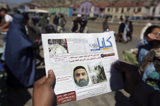 An Afghan man reads a local newspaper on May 25 with photos of the former leader of the Afghan Taliban, Mullah Akhtar Mansour, who was killed in a U.S. drone strike in Kabul, Afghanistan. (Photo: Rahmat Gul/AP)