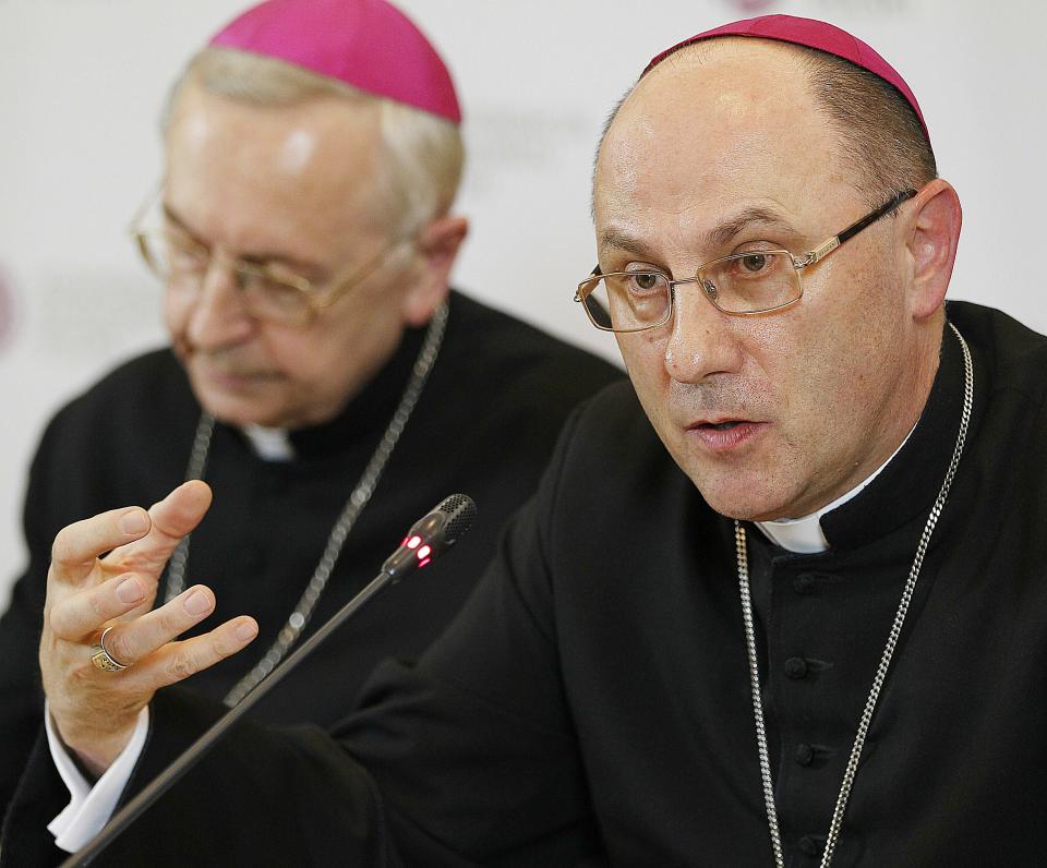 FILE -- In this Thursday, March 14, 2019 photo the head of Poland's Catholic Church Archbishop Wojciech Polak, right, addresses the media during a news conference in Warsaw, Poland, in which the church revealed it has recorded cases of 382 priests abusing minors since 1990. At left is Archbishop Henryk Gadecki, the head of Poland's Episcopate. (AP Photo/Czarek Sokolowski, file)