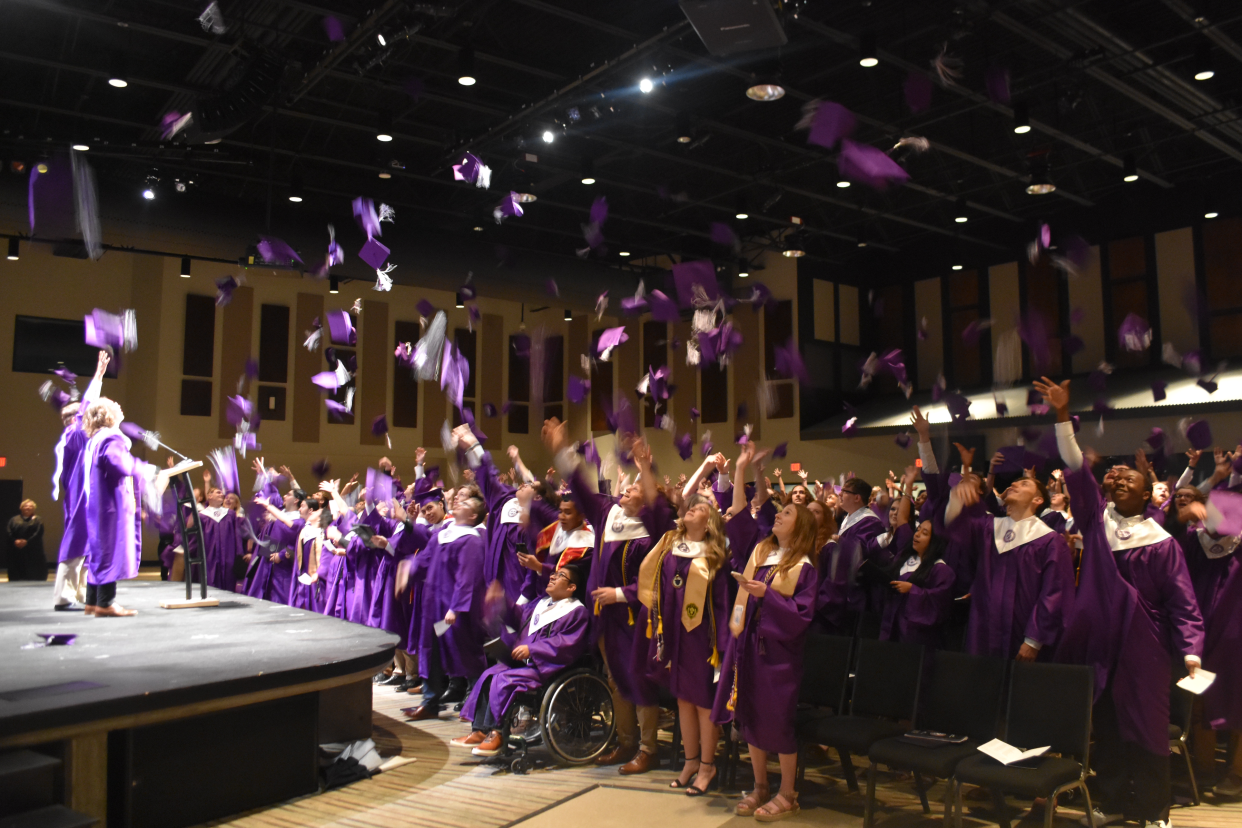 Portland Class of 2023 seniors toss their mortar boards in the air.