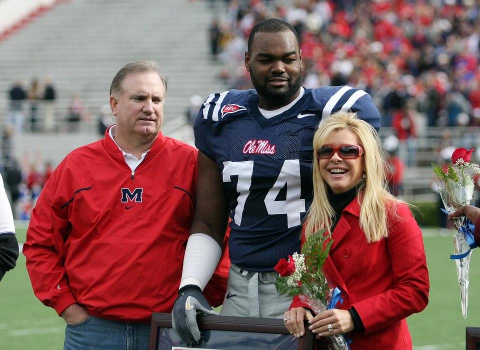 Michael Oher #74 of the Ole Miss Rebels stands with his family during senior ceremonies prior to a game against the Mississippi State Bulldogs at Vaught-Hemingway Stadium on November 28, 2008 in Oxford, Mississippi.