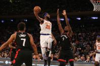 Feb 9, 2019; New York, NY, USA; New York Knicks center Mitchell Robinson (26) shoots against Toronto Raptors forward Serge Ibaka (9) during the third quarter at Madison Square Garden. Mandatory Credit: Brad Penner-USA TODAY Sports