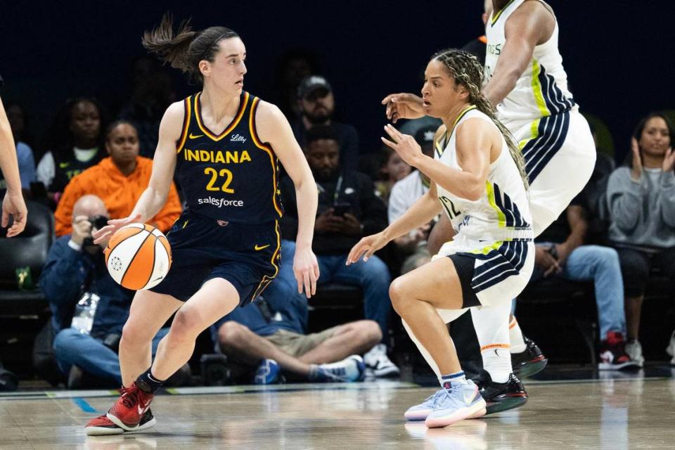 Indiana Fever guard Caitlin Clark (22) is guarded by Dallas Wings guard Veronica Burton (12) in the second quarter of a WNBA preseason game at College Park Center in Arlington on Friday, May 3, 2024.