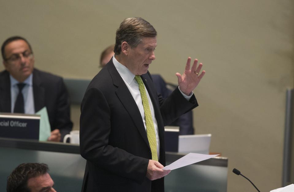 A homeless advocate gestures to Mayor John Tory after he made a motion to delay the discussion on the homeless issue and to open the Armouries. (Bernard Weil/Toronto Star via Getty Images)