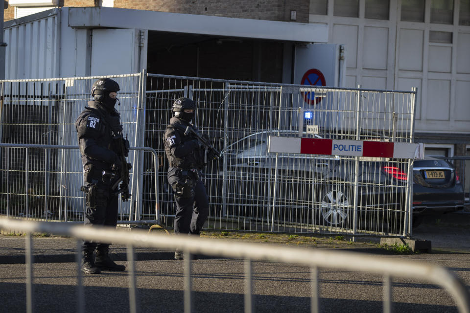 A vehicle carrying suspects arrives at the high security court in Amsterdam, Netherlands, Tuesday, Feb. 27, 2024, where judges are to rule in the Marengo case, the largest trial in Dutch history with seventeen defendants accused of participation in a criminal organisation and of involvement in 6 murders and 4 attempted murders.(AP Photo/Peter Dejong)