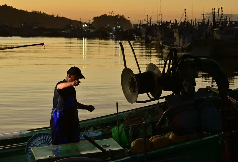 A fisherman works at Matsukawaura fishing port in Soma