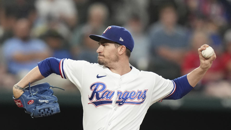 Texas Rangers starting pitcher Andrew Heaney throws during the first inning of a baseball game against the Detroit Tigers in Arlington, Texas, Monday, June 26, 2023. (AP Photo/LM Otero)