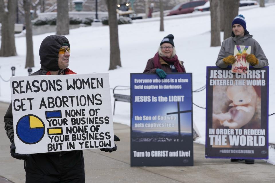 Tim Jones stands outside the Wisconsin Capitol during a march supporting overturning Wisconsin's near total ban on abortion Sunday, Jan. 22, 2023, in Madison, Wis. (AP Photo/Morry Gash)