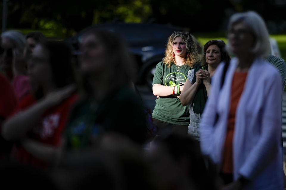 Local residents join survivors of the 2012 Sandy Hook Elementary School shooting for a rally against gun violence on Friday, June 7, 2024 in Newtown, Conn. (AP Photo/Bryan Woolston)