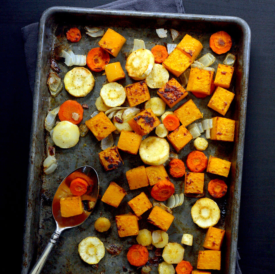 <p>This easy roasted butternut squash and root vegetables recipe is incredibly versatile. Pile the squash and veggies onto grain bowls, add to sandwiches, toss in soup, serve as a side dish--you name it. Roasting vegetables in the oven gives you 20 minutes of hands-off cooking time to assemble the rest of your meal. <a href="https://www.eatingwell.com/recipe/273587/roasted-butternut-squash-root-vegetables/" rel="nofollow noopener" target="_blank" data-ylk="slk:View Recipe;elm:context_link;itc:0;sec:content-canvas" class="link ">View Recipe</a></p>