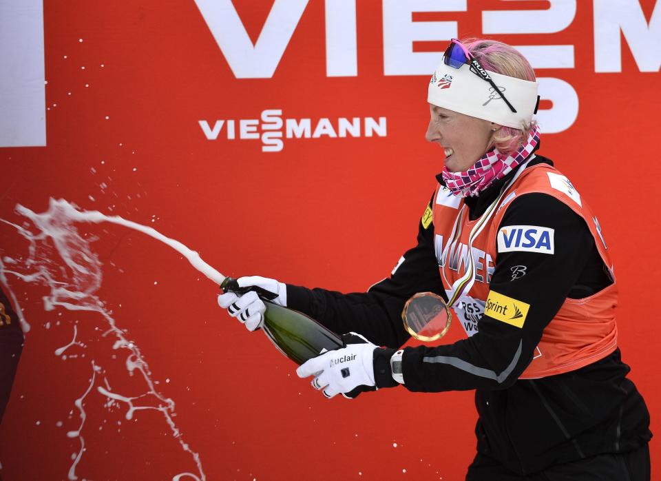 U.S. Kikkan Randall sprays celebrates on the podium after winning the FIS sprint World Cup cross country ski event in Falun, Sweden, Friday March 14, 2014. (AP photo / Anders Wiklund) SWEDEN OUT