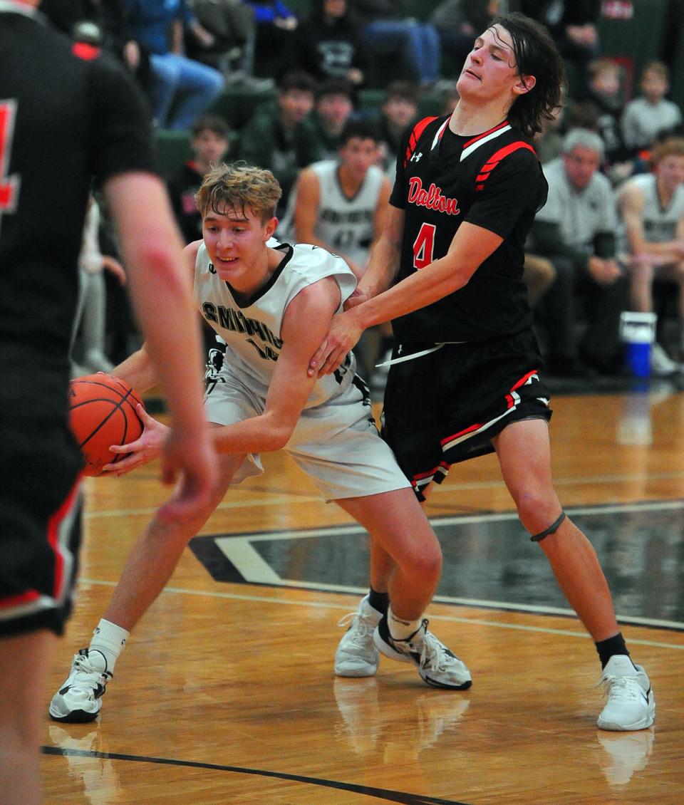 Smithville's Reece Riggenbach tries to clear space against Dalton's Colin Pearson.