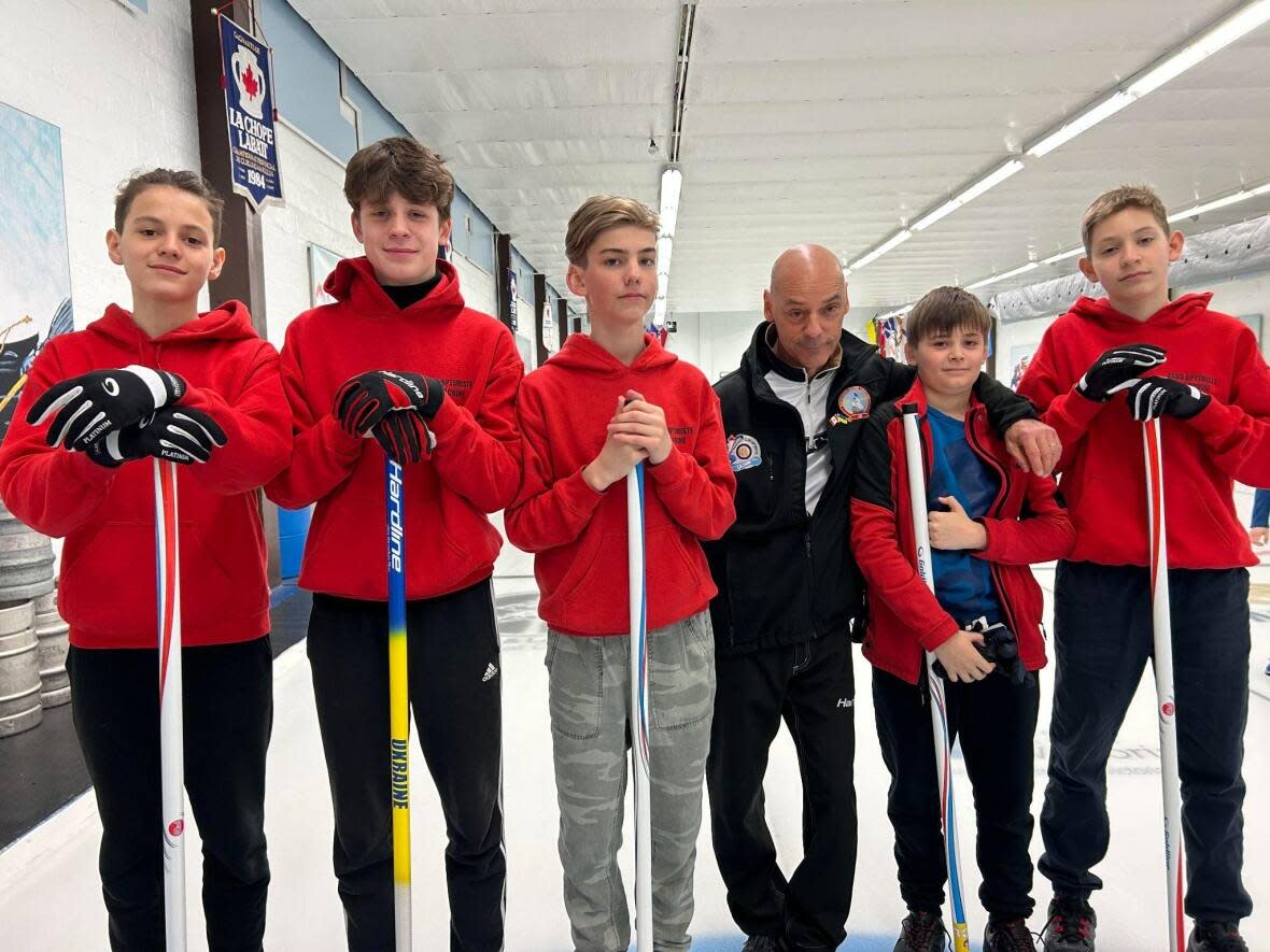 Coach Martin Vaillancourt says the five teens from Ukraine have shown lots of progress on the ice, but what is most important is that they have fun. (Rowan Kennedy/CBC - image credit)