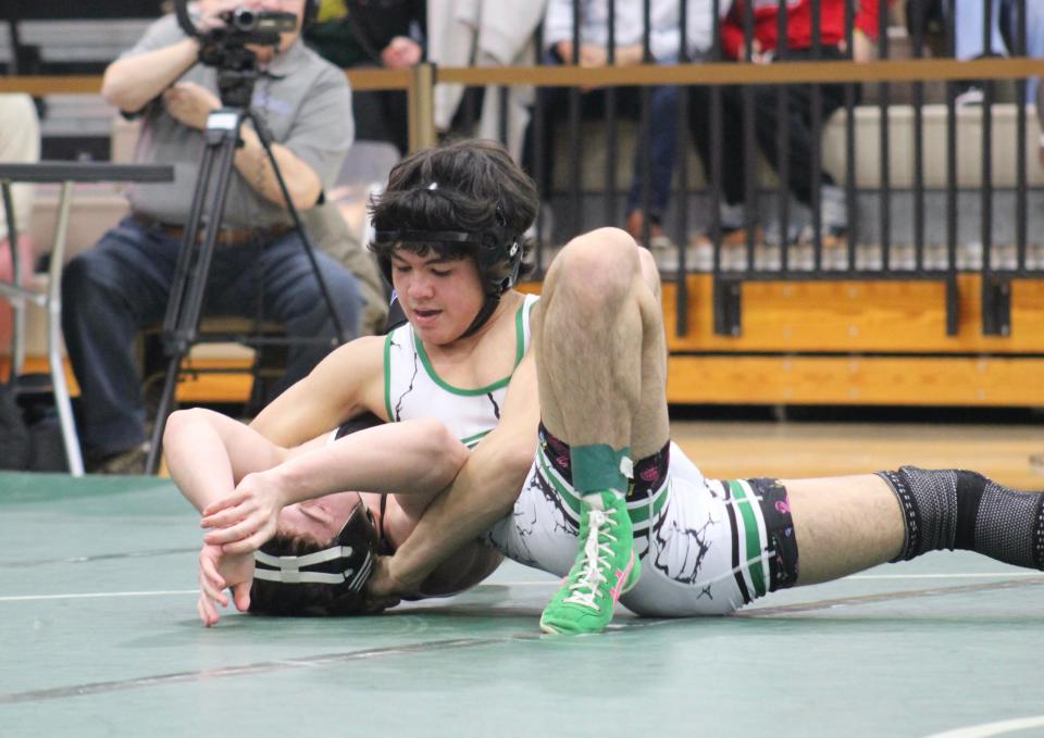 Dublin Coffman’s Eli Esguerra pins Olentangy Liberty’s Ian Wishart at 150 pounds during Coffman’s 47-18 home win Jan. 11.