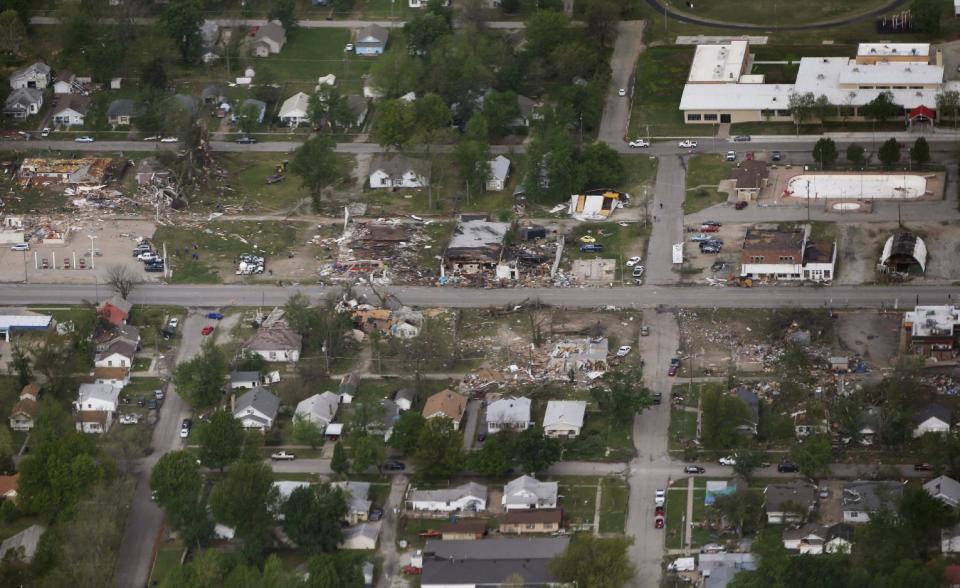 A tornado's path is seen in an aerial photo made over Baxter Springs, Kan., Monday, April 28, 2014. A tornado damaged dozens of buildings and injured at least 25 people on Sunday. (AP Photo/Orlin Wagner)