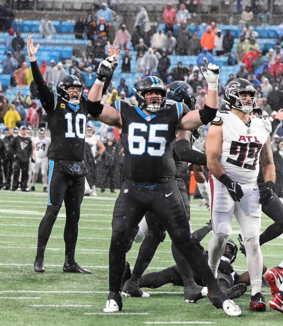 Carolina Panthers players celebrate place kicker Eddy Pineiro’s winning kick against the Atlanta Falcons at the Bank of America Stadium in Charlotte, N.C., on Sunday, December 17, 2023. Khadejeh Nikouyeh/Knikouyeh@charlotteobserver.com