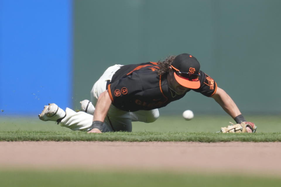 San Francisco Giants second baseman Brett Wisely makes a fielding error on a ground ball hit by Baltimore Orioles' Anthony Santander during the ninth inning of a baseball game in San Francisco, Sunday, June 4, 2023. (AP Photo/Jeff Chiu)