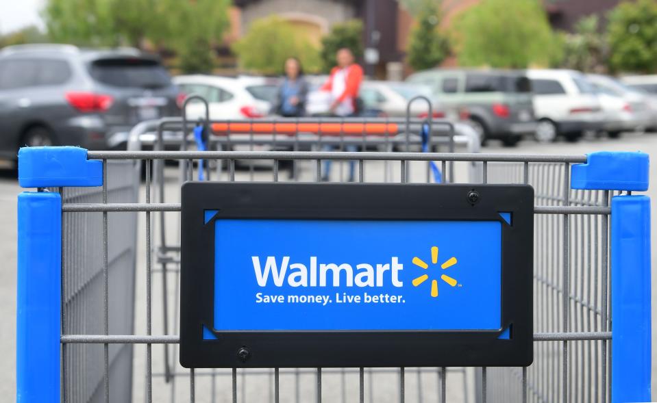 Walmart has started a new home delivery service where its employees will come into your home and stock up your refrigerator. Here, shoppers are at a Walmart Supercenter in Rosemead, Calif., on May 23, 2019.