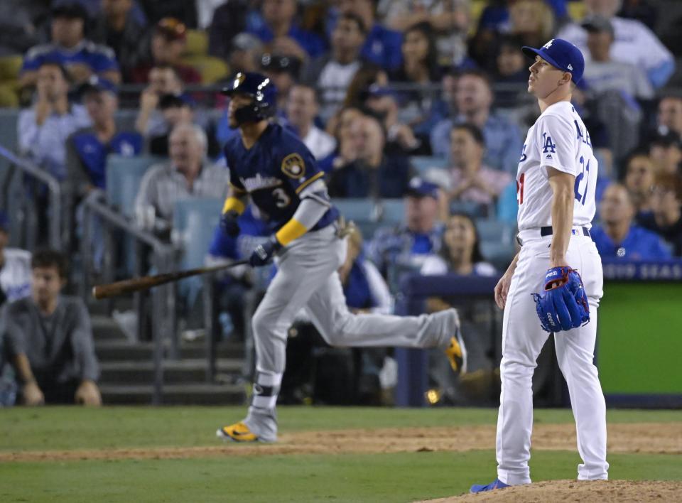 Los Angeles Dodgers starting pitcher Walker Buehler watches after Milwaukee Brewers' Orlando Arcia hits a two-run home run during the seventh inning of Game 3 of the National League Championship Series baseball game Monday, Oct. 15, 2018, in Los Angeles. (AP Photo/Mark J. Terrill)