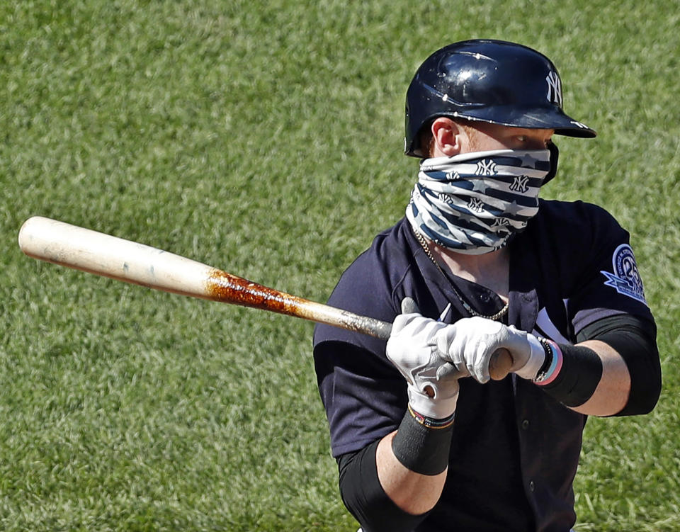 New York Yankees' Clint Frazier wears a face mask while batting during an intrasquad game in baseball summer training camp Sunday, July 12, 2020, at Yankee Stadium in New York. (AP Photo/Kathy Willens)