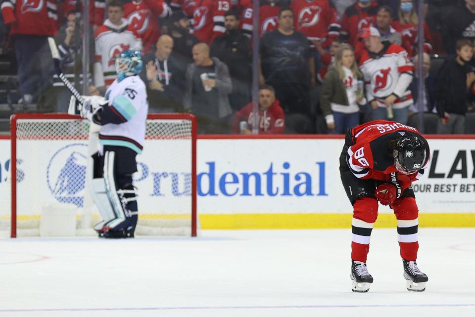 Oct 19, 2021; Newark, New Jersey, USA; New Jersey Devils center Jack Hughes (86) skates off the ice after being hit during the first period of their game against the Seattle Kraken at Prudential Center. Mandatory Credit: Ed Mulholland-USA TODAY Sports