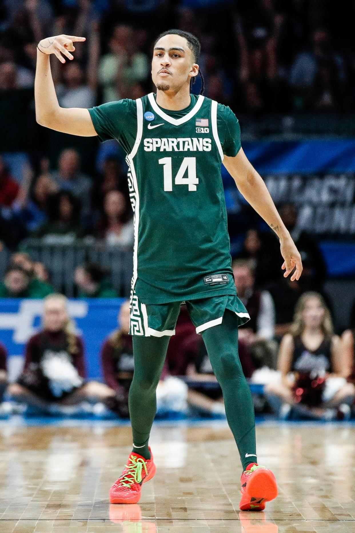 Michigan State guard Davis Smith (14) celebrates a three point basket against Mississippi State during the second half of NCAA tournament West Region first round at Spectrum Center in Charlotte, N.C. on Thursday, March 21, 2024.