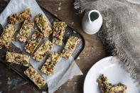 <p>You can prepare your own healthy snacks in bulk if you'd like, or simply buy them and keep them in your kitchen. It's never a bad idea to take them with you whenever you're going out too. </p><p>Some ideas for healthy snacks include protein bars that are low on sugar, carrots or celery sticks with hummus, Greek yogurt with apples or berries, a smoothie with lots of veggies or fruits (and no added sugar), or something like chia seed pudding that you can make on your own. </p>