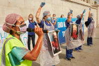 LONDON, ENGLAND - SEPTEMBER 12: NHS workers chant slogans during a protest at Trafalgar Square on September 12, 2020 in London, England. NHS staff marched from BBC Broadcasting House to Trafalgar square in a bid to secure higher wages for themselves following the hardships that they have faced in handling patients with Coronavirus. (Photo by Alex McBride/Getty Images)