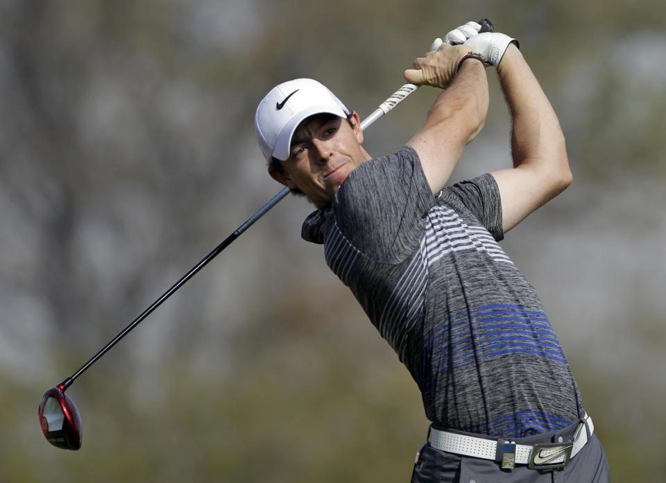 Rory McIlroy of Northern Ireland tees off on the 11th hole during the 3rd round of the Abu Dhabi HSBC Golf Championship in Abu Dhabi, United Arab Emirates, Saturday Jan. 18, 2014. (AP Photo/Kamran Jebreili)